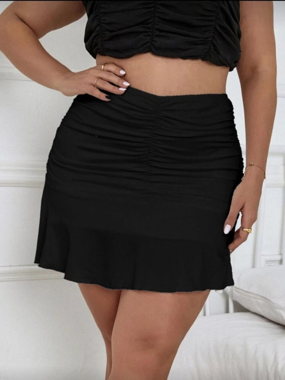 Elegant women's high-waisted, gathered skirt with a beautiful drape.